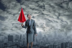 Businesswoman outside in bad weather