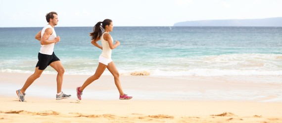 A Man and a Woman Jogging Near the Beach Image